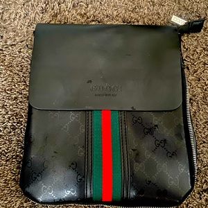 A gucci clutch w strap used but still looks great